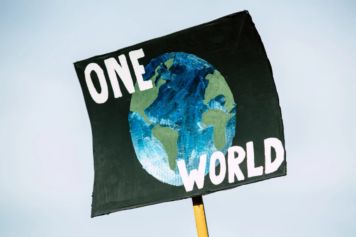 sign showing a globe and the wording "one word"