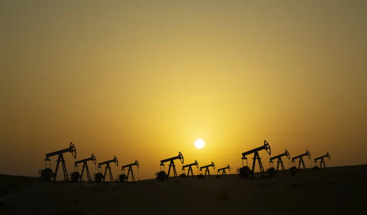 Dubai. Oil pumps in Empty Quarter Desert Desert at sunset.
